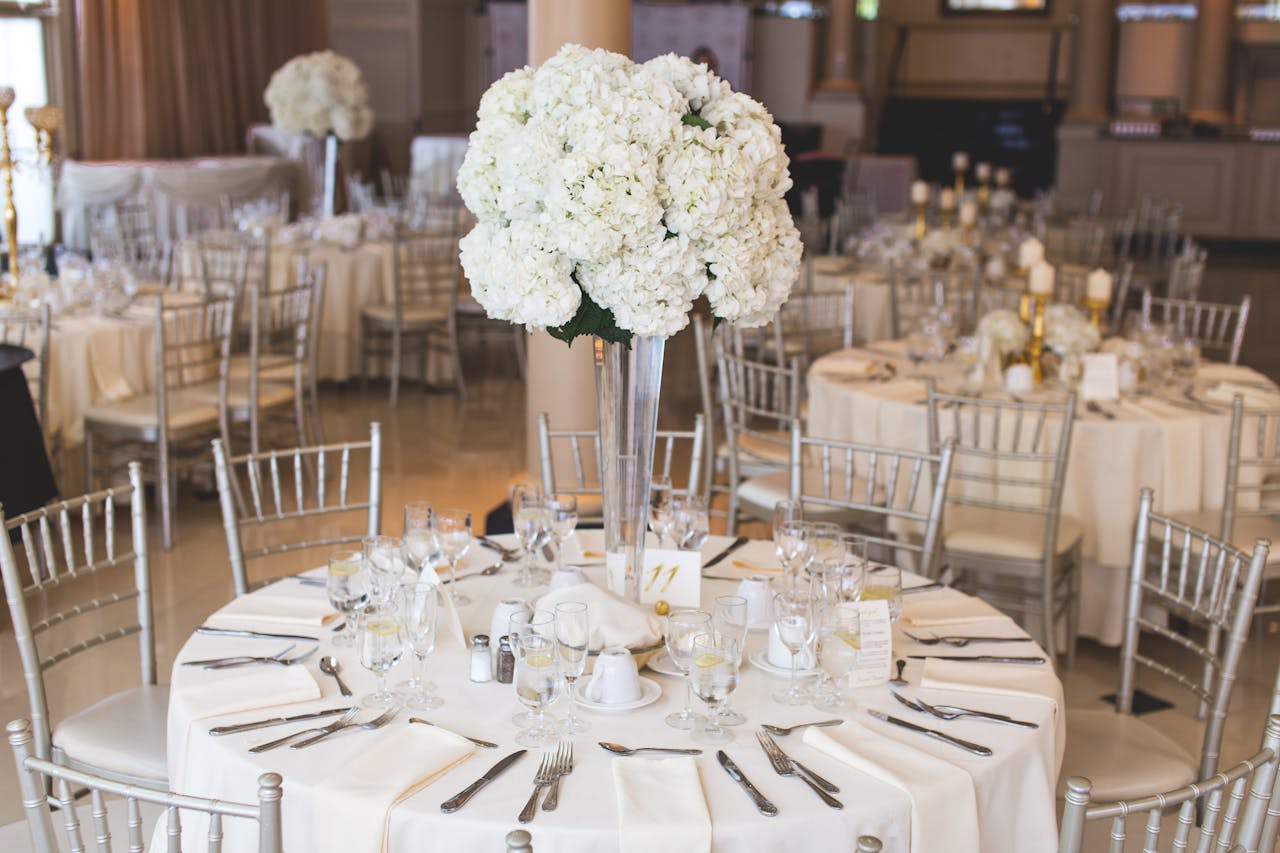Mastering the First Impression: Your intriguing post title goes here Beautifully decorated wedding reception table with elegant floral centerpiece and silverware.